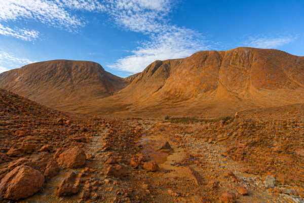 Orange mantle rock landscape at the Tablelands in Gros Morne National Park, Newfoundland.